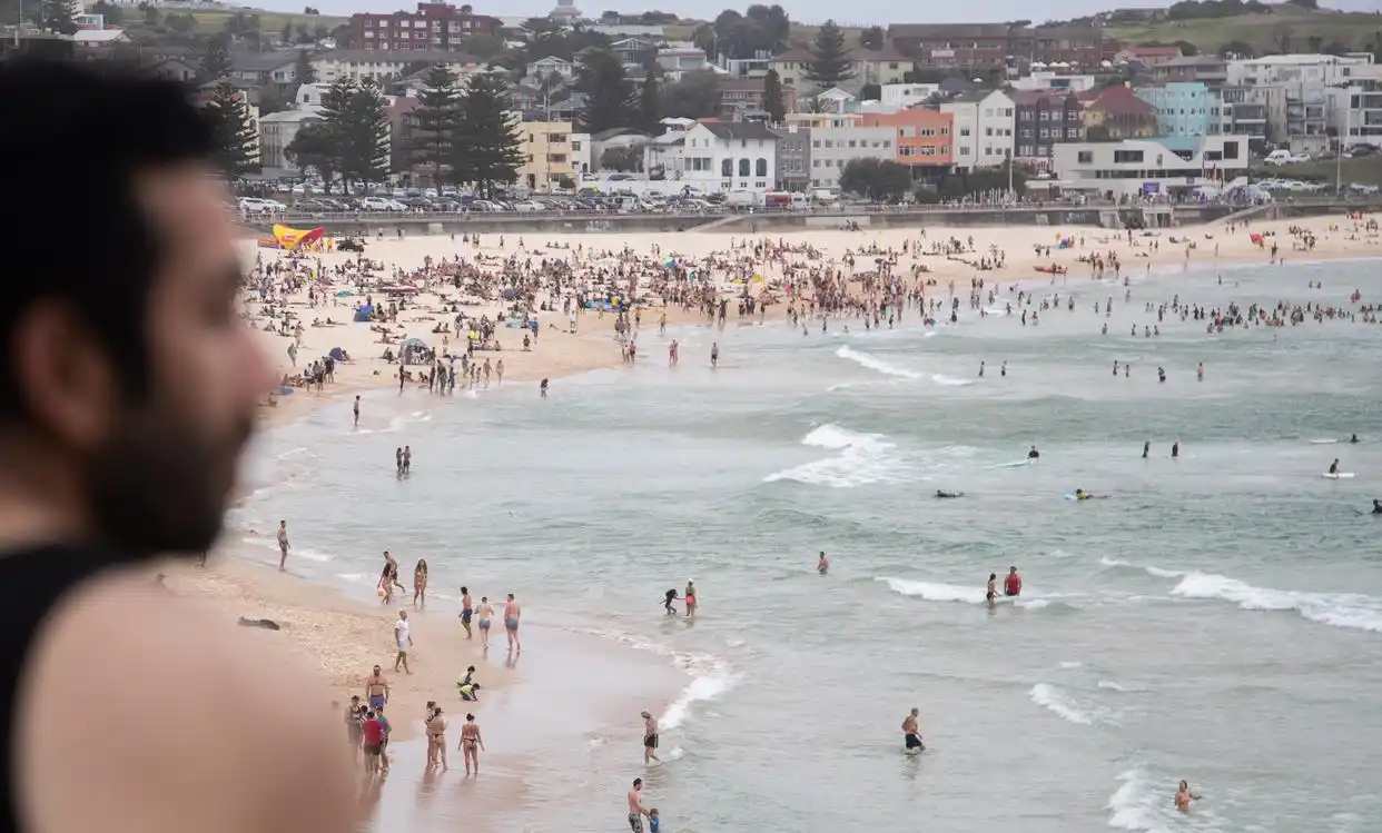 People are cooling off and swimming at Bondi Beach in Sydney, Australia.